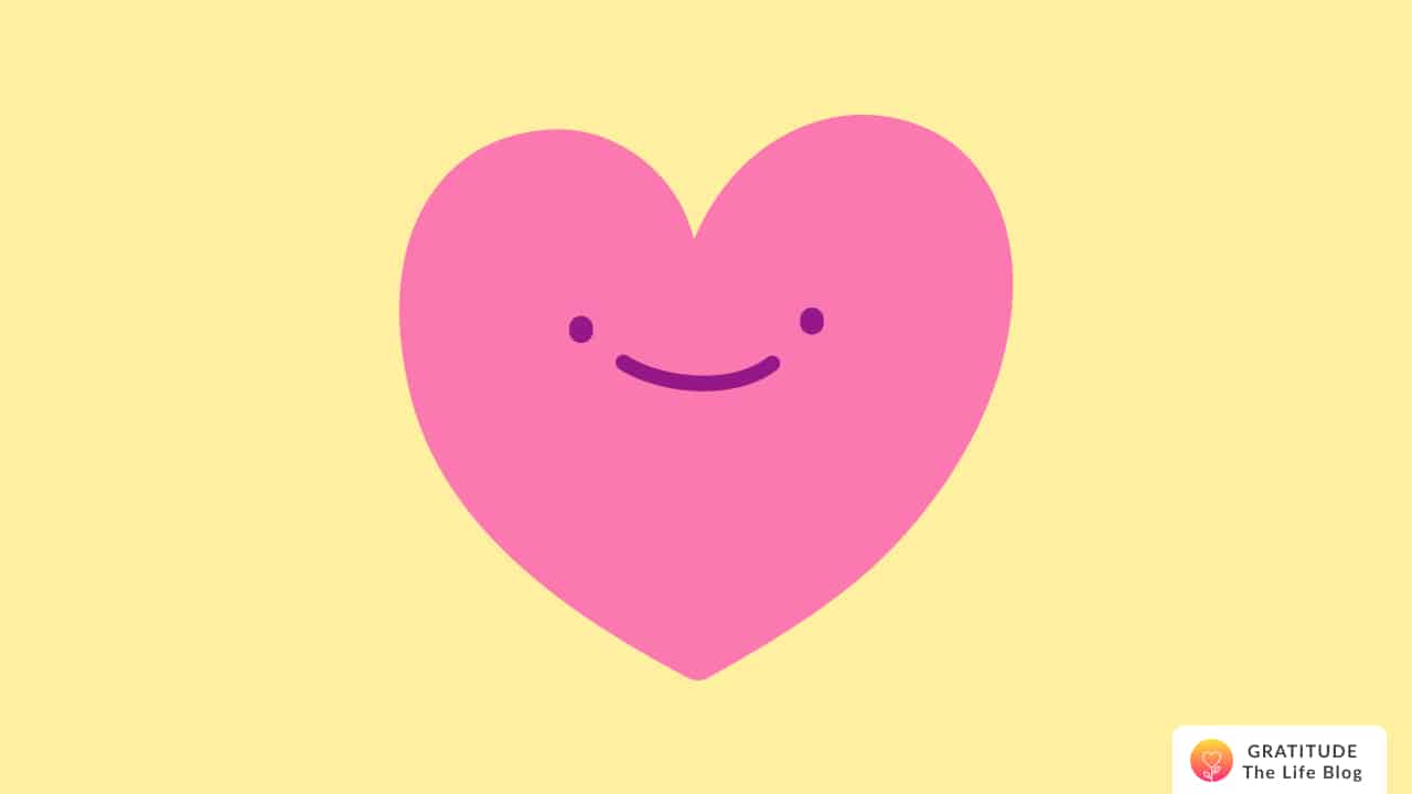 An illustration of a pink smiling heart