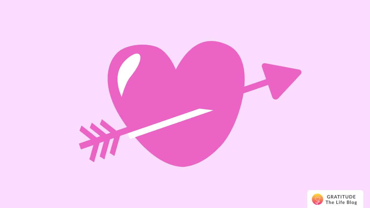 A soft pink heart with an arrow through it