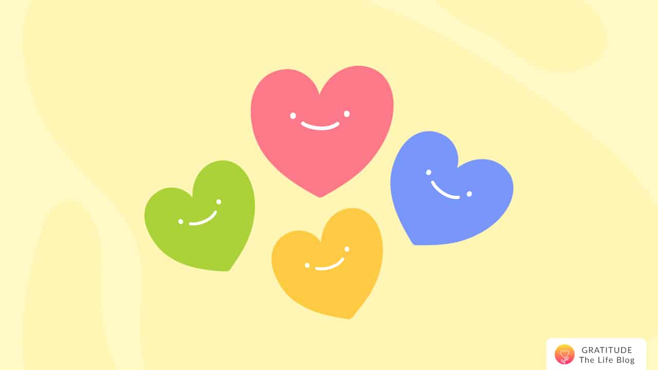 Image with illustration of 4 smiling hearts in red, blue, yellow, and green colour.