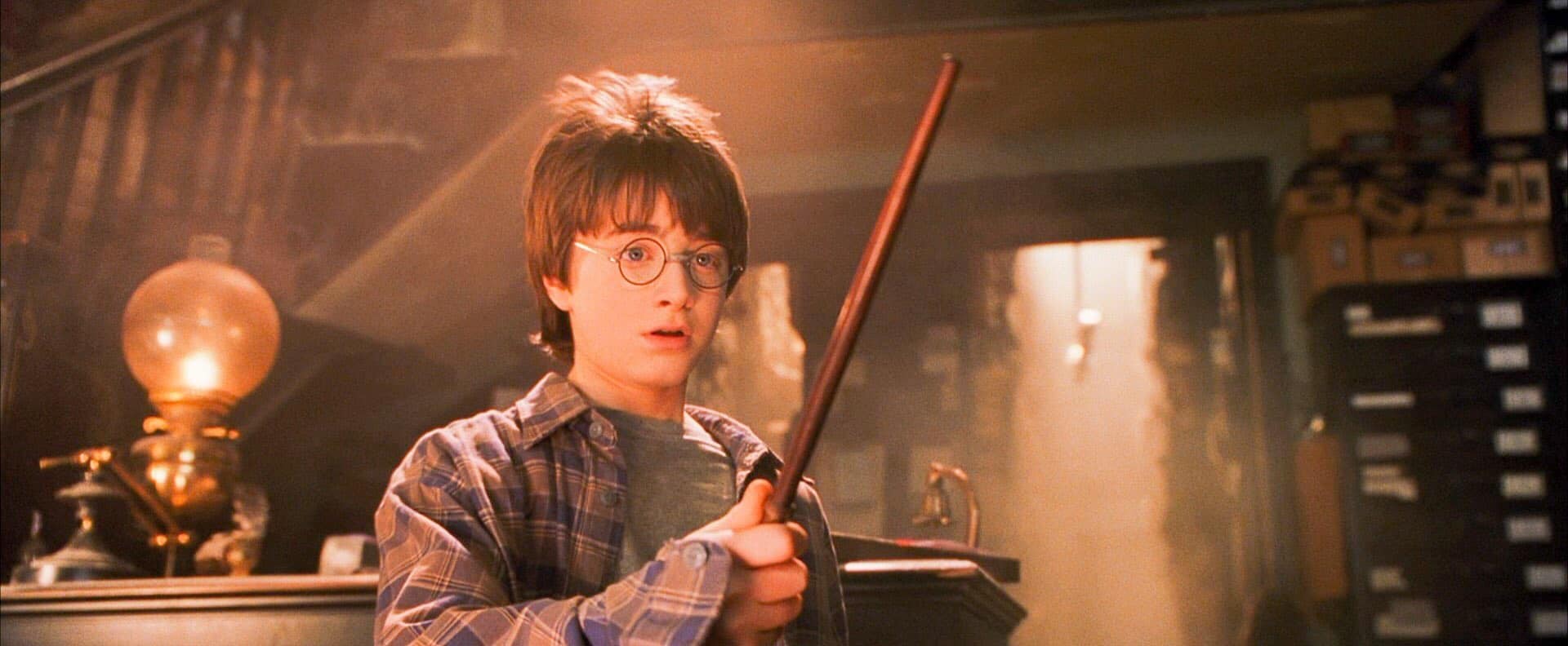 Photo of Harry Potter holding his wand for the first time